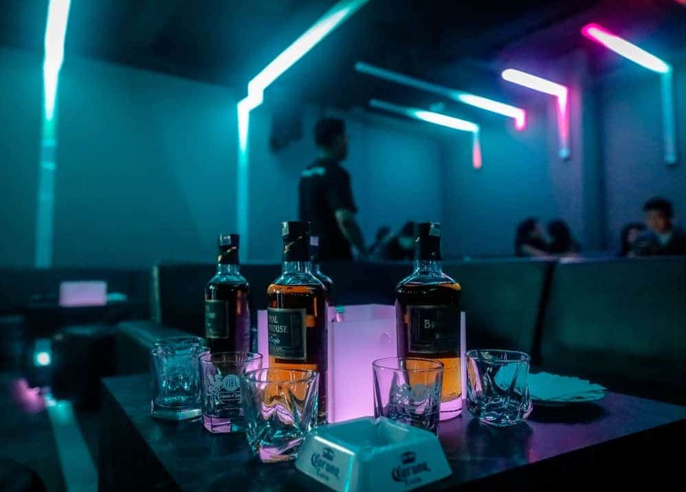Why getting bottle service at your favorite country and southern bar is the way to celebrate 2 bottle on table: Benefits of Getting Bottle Service