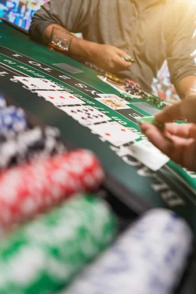 man playing blackjack at the casino