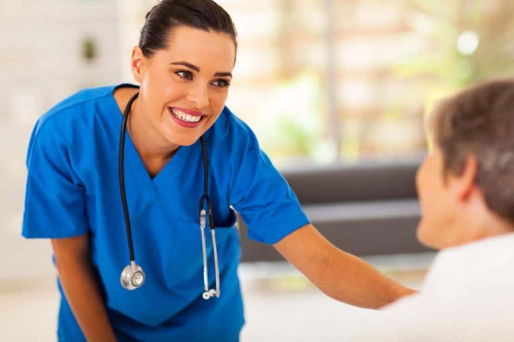 Everything You Need to Know About a Nursing Director Career 3 Nurse talking to Patient